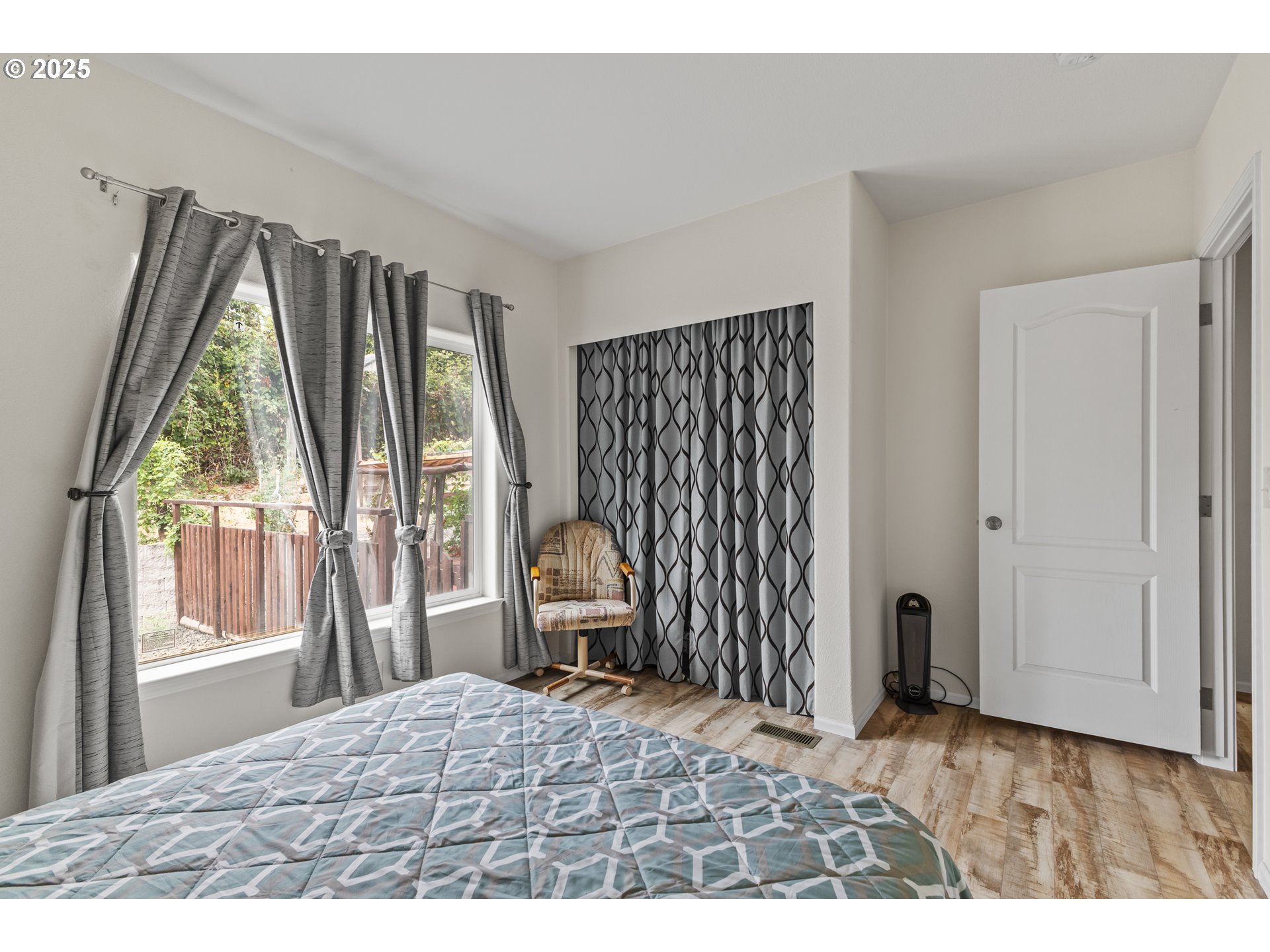 1873 East Cedar Street Myrtle Point, OR 97458 - Photo 19 of 27 a view of a bedroom with wooden floor and a window