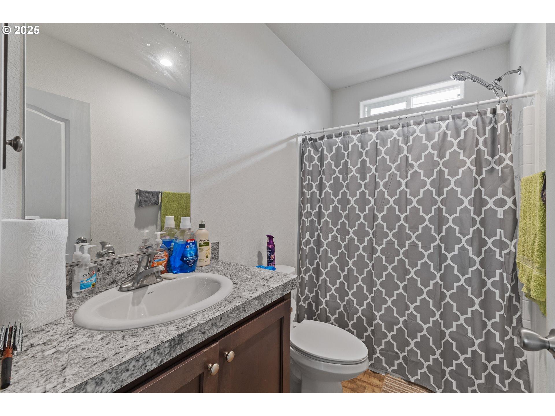 1873 East Cedar Street Myrtle Point, OR 97458 - Photo 21 of 27 a bathroom with a granite countertop sink and a mirror