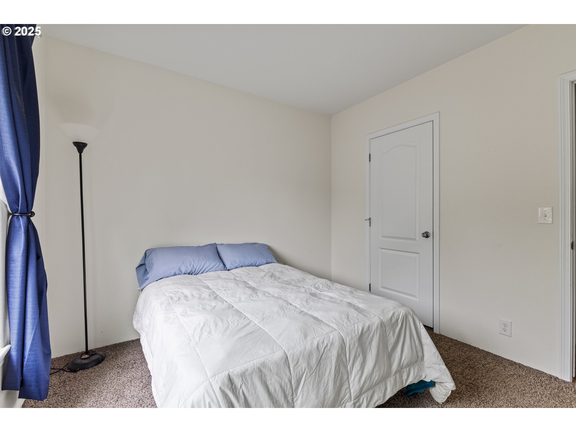 1873 East Cedar Street Myrtle Point, OR 97458 - Photo 25 of 27 a bedroom with a bed and a flat tv screen on the dresser