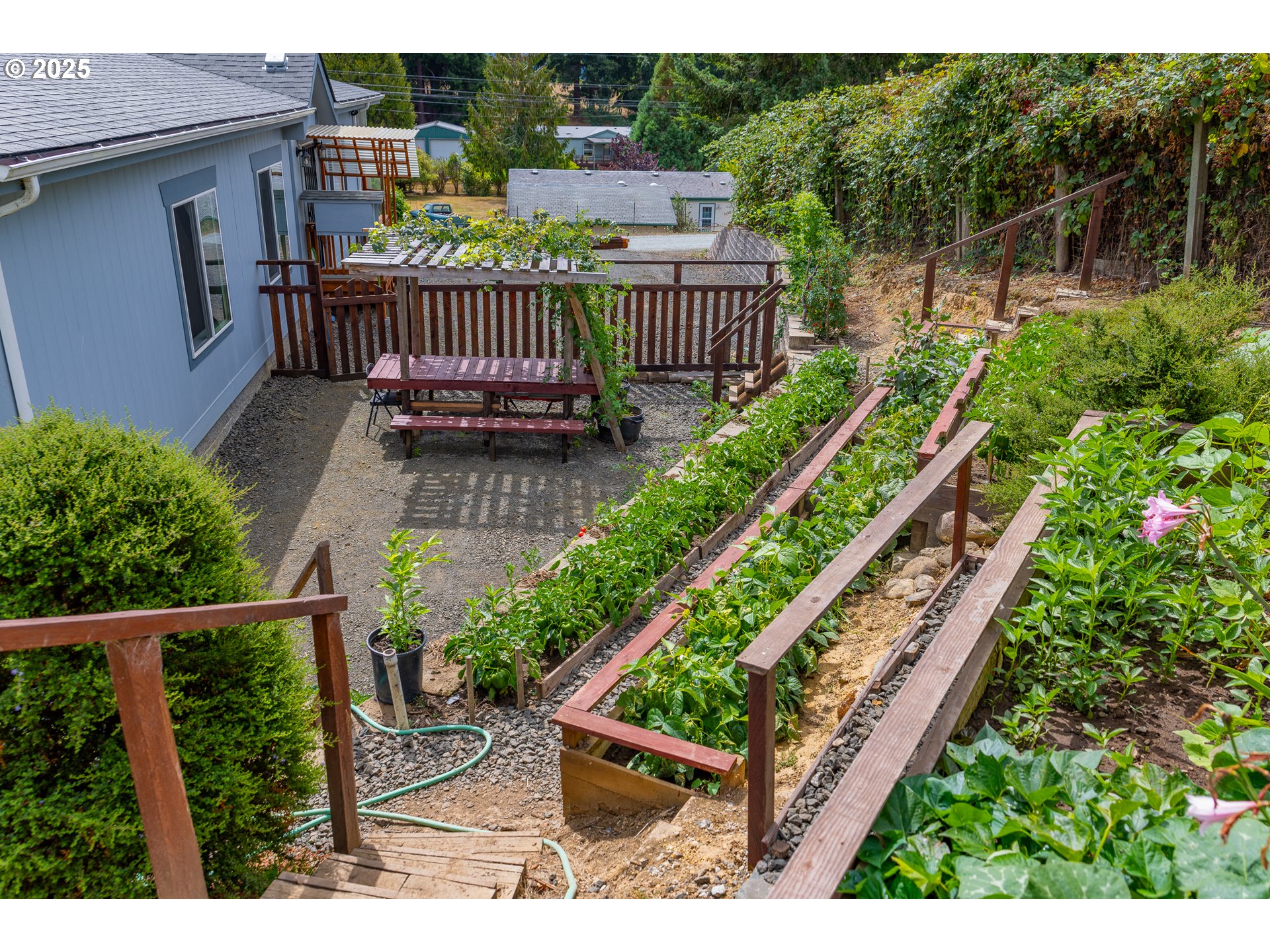 1873 East Cedar Street Myrtle Point, OR 97458 - Photo 4 of 27 a view of a roof deck with wooden fence and a bench
