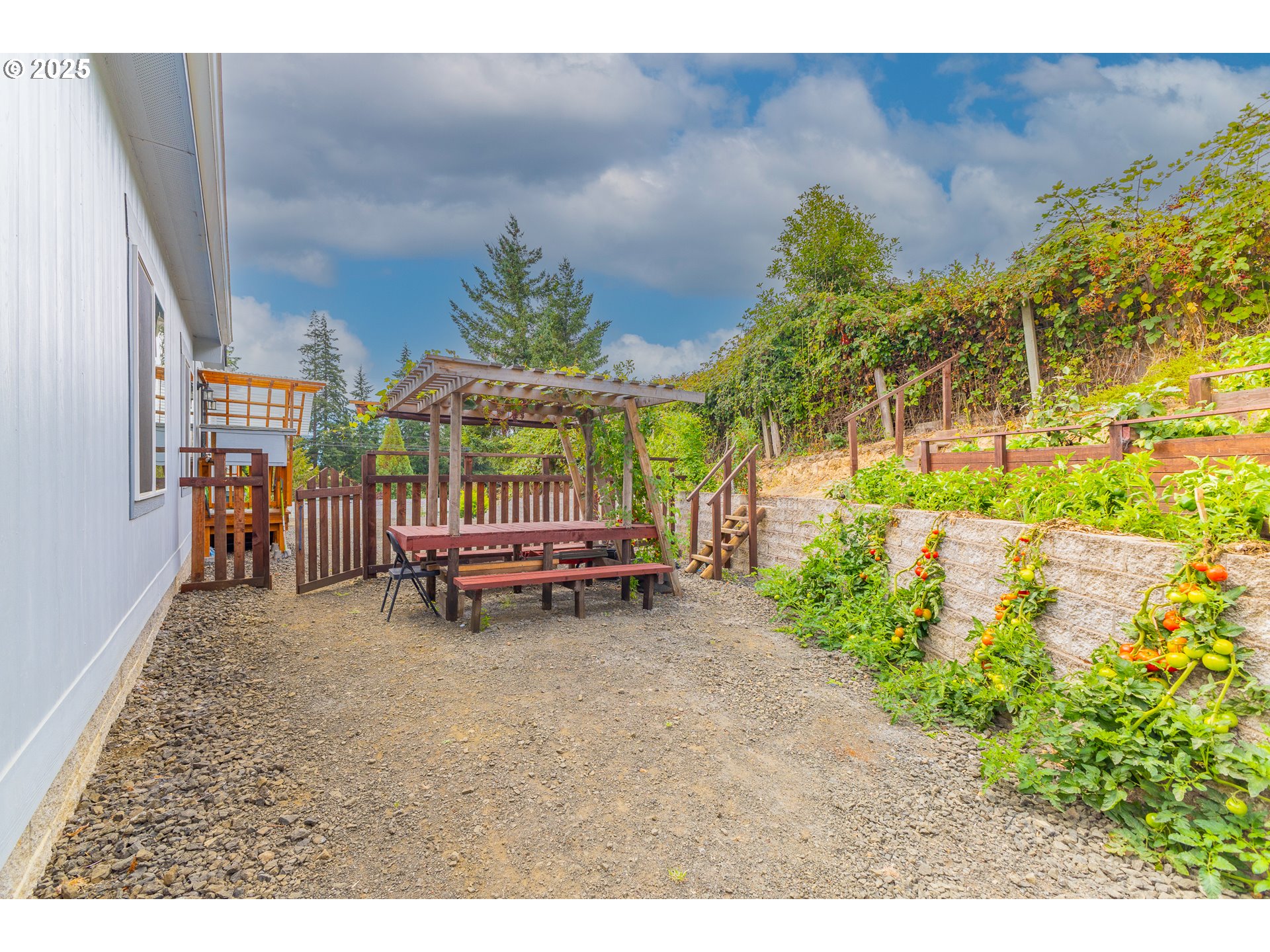 1873 East Cedar Street Myrtle Point, OR 97458 - Photo 7 of 27 a backyard of a house with table and chairs