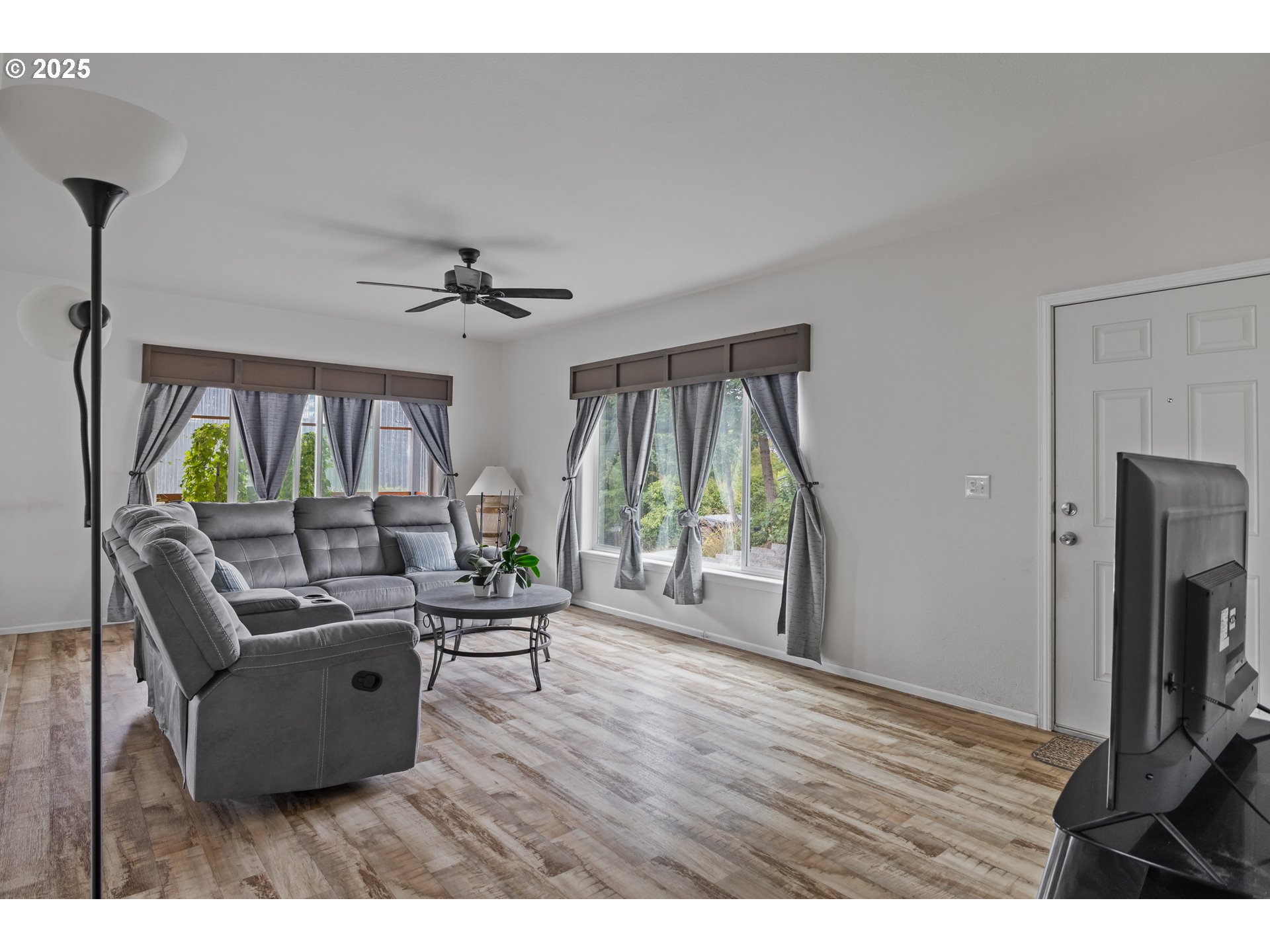 1873 East Cedar Street Myrtle Point, OR 97458 - Photo 9 of 27 a living room with furniture and a flat screen tv