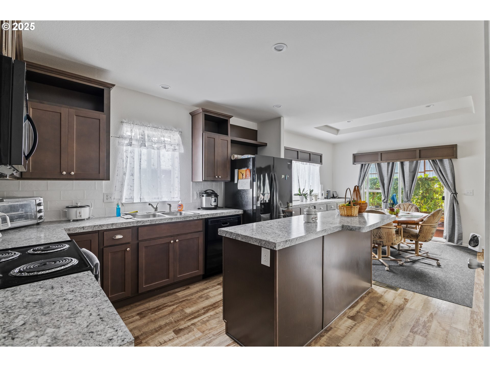 1873 East Cedar Street Myrtle Point, OR 97458 - Photo 10 of 27 a kitchen with sink stove and cabinets
