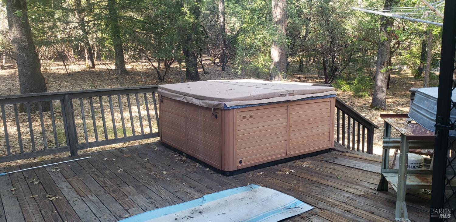 8312 Harrington Flat Road Middletown, CA 95461 - Photo 12 of 19 a view of a wooden floor with a bench