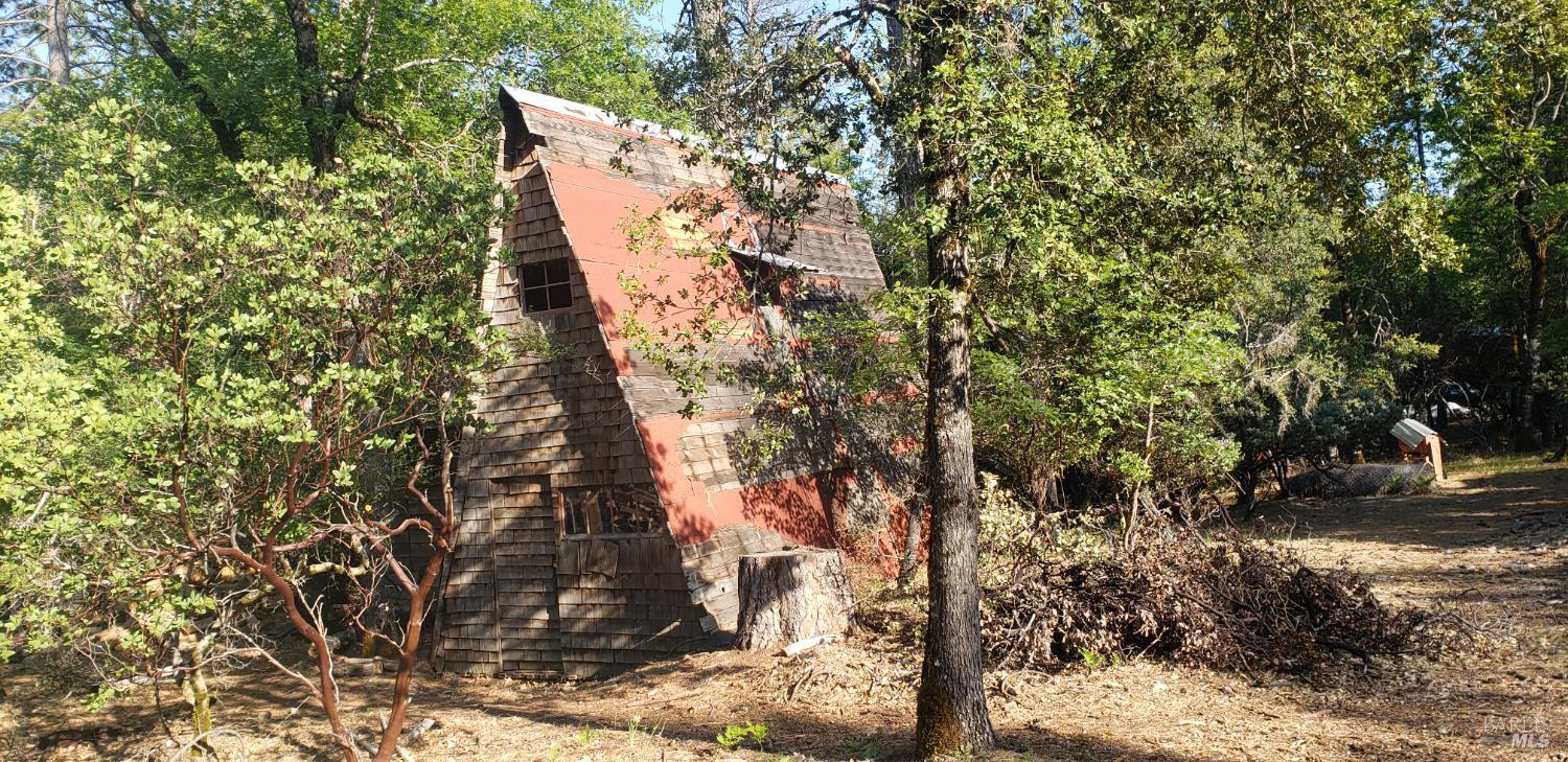 8312 Harrington Flat Road Middletown, CA 95461 - Photo 13 of 19 a backyard of a house with lots of green space