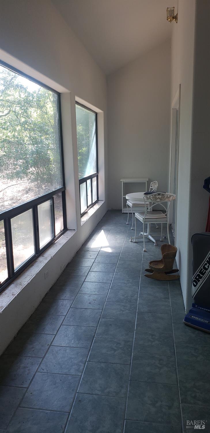 8312 Harrington Flat Road Middletown, CA 95461 - Photo 16 of 19 a living room with furniture and a window