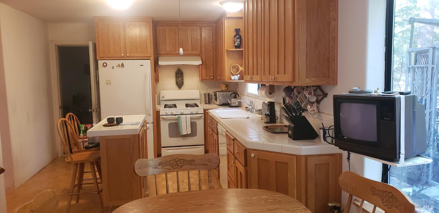 8312 Harrington Flat Road Middletown, CA 95461 - Photo 4 of 19 a kitchen with a sink appliances and cabinets