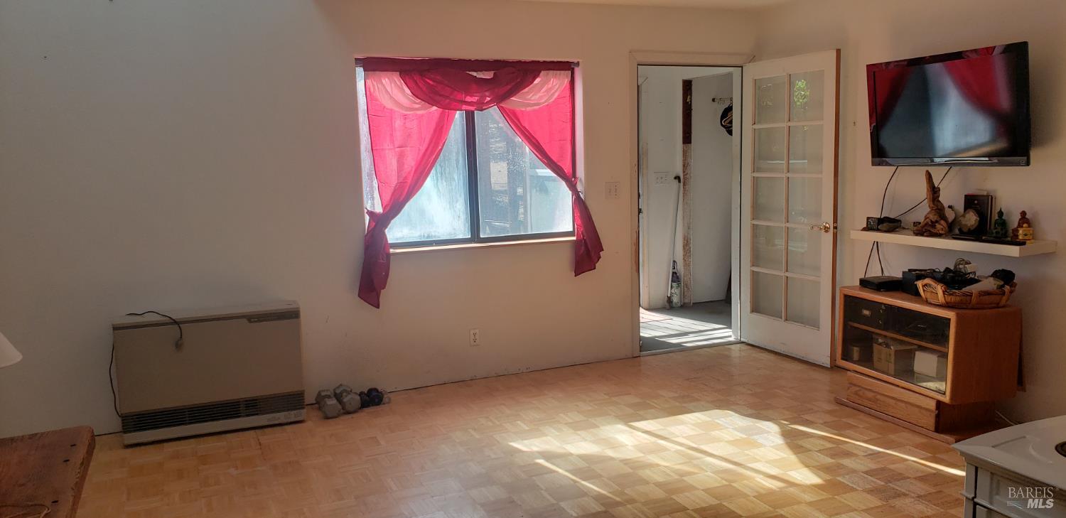 8312 Harrington Flat Road Middletown, CA 95461 - Photo 6 of 19 a view of a room with window and a flat screen tv