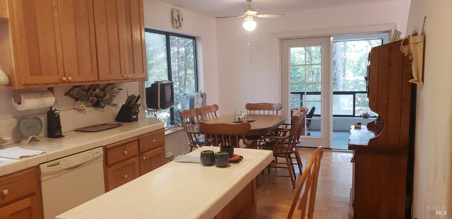 8312 Harrington Flat Road Middletown, CA 95461 - Photo 7 of 19 a kitchen with a sink refrigerator and cabinets