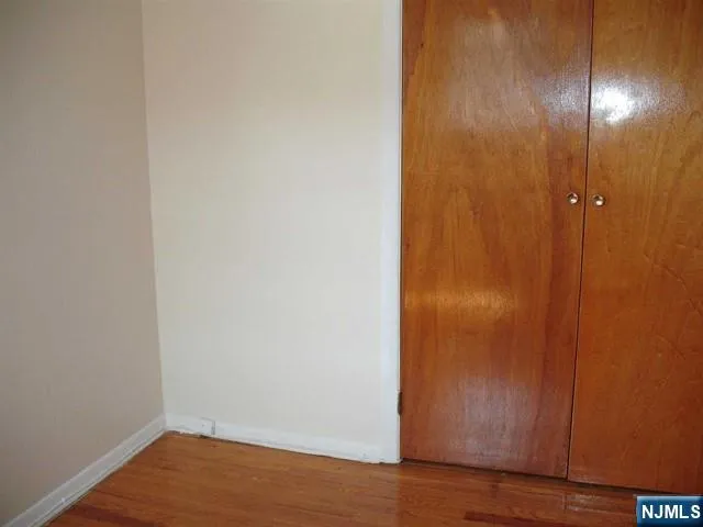 a view of a small space with wooden floor