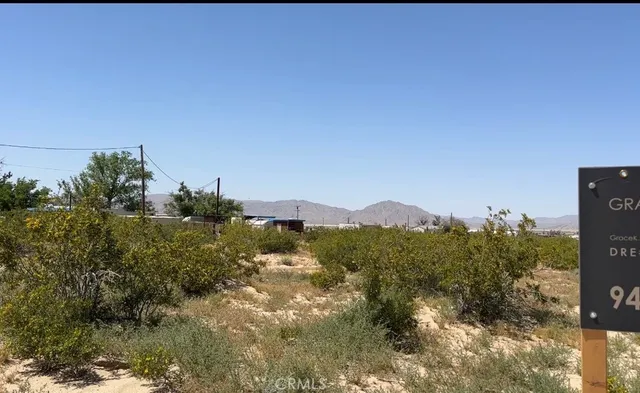 a view of a town with mountains in the background