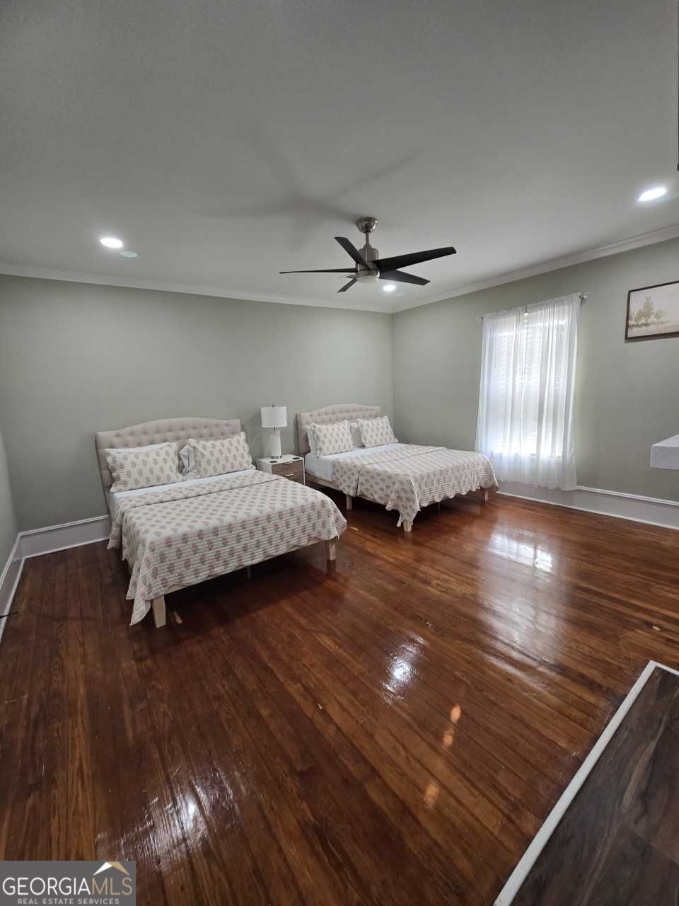 402 Meriwether Street Griffin, GA 30224 - Photo 16 of 38 a living room with furniture and a wooden floor