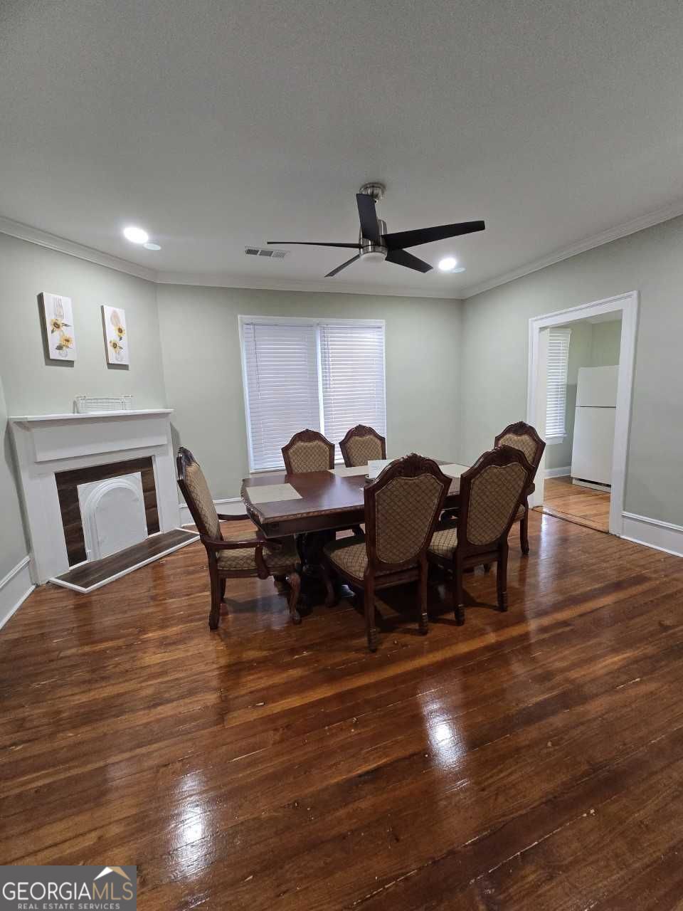 402 Meriwether Street Griffin, GA 30224 - Photo 23 of 38 a view of a dining room with furniture and wooden floor