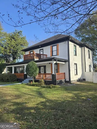 a view of a house with a big yard