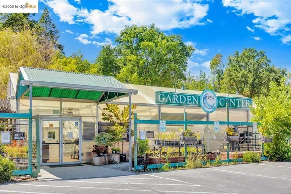 a view of a street with a building and a street sign