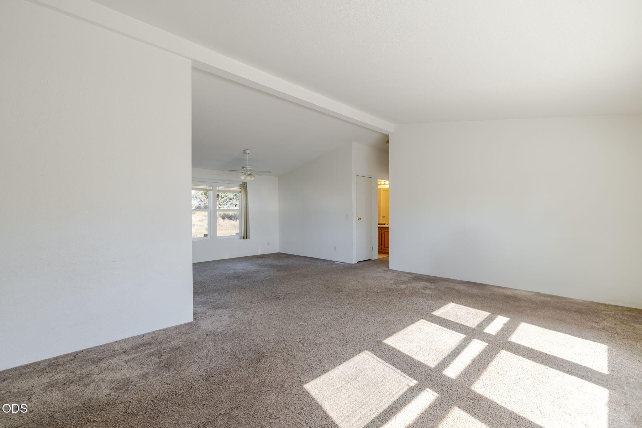 8628 Southwest Crater Loop Road Terrebonne, OR 97760 - Photo 8 of 36 an empty room with windows