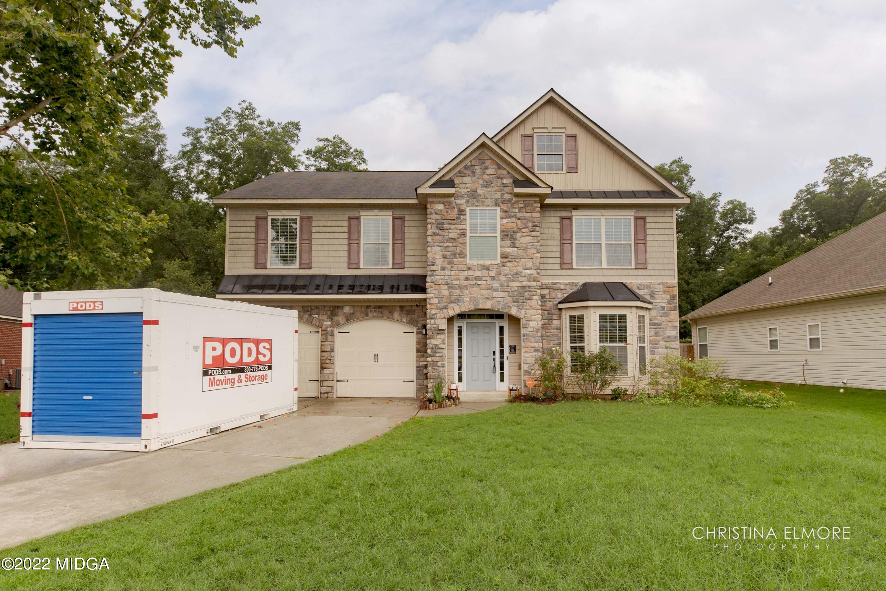 209 McEwen Court Perry, GA 31069 - Photo 1 of 39 a front view of a house with a yard