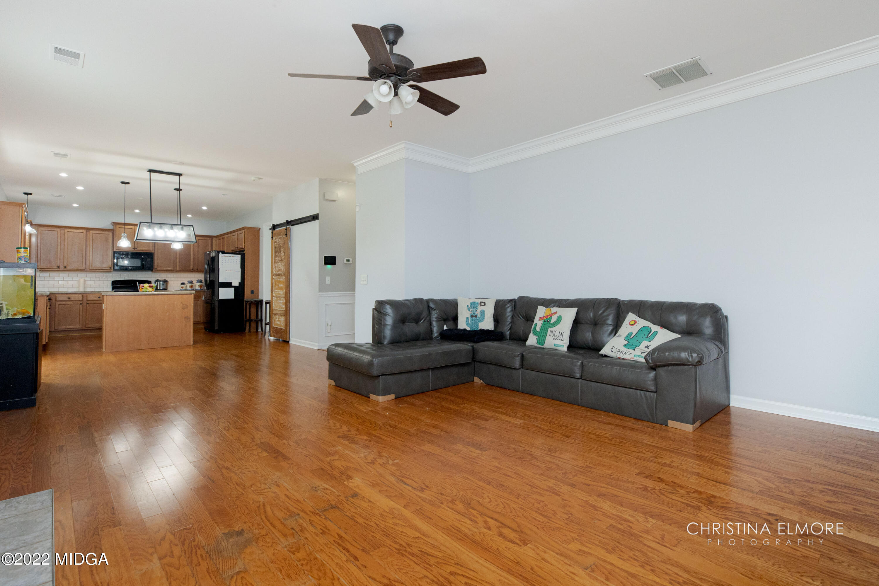 209 McEwen Court Perry, GA 31069 - Photo 18 of 39 a living room with furniture and kitchen view