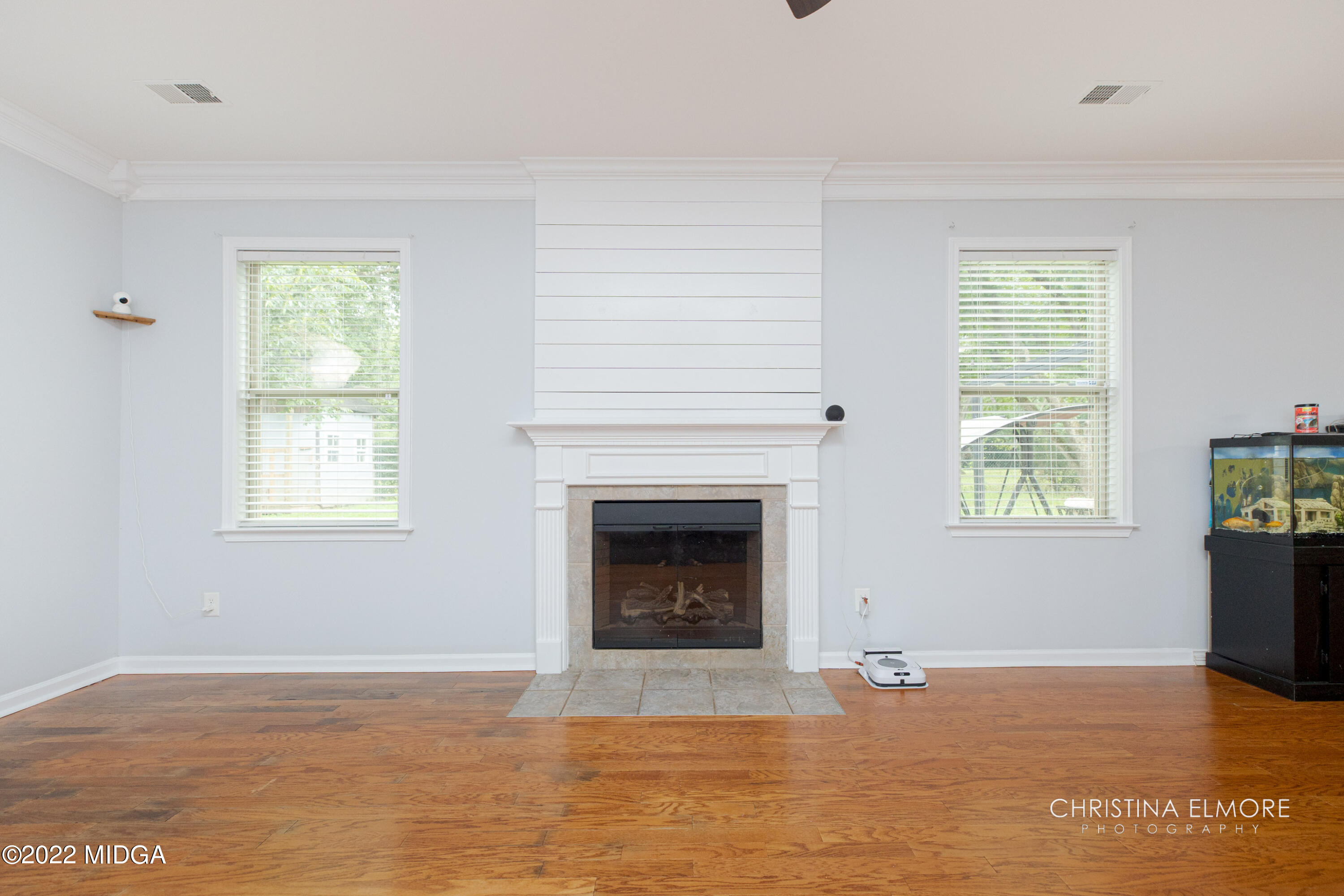209 McEwen Court Perry, GA 31069 - Photo 20 of 39 a view of an empty room with window and fire place