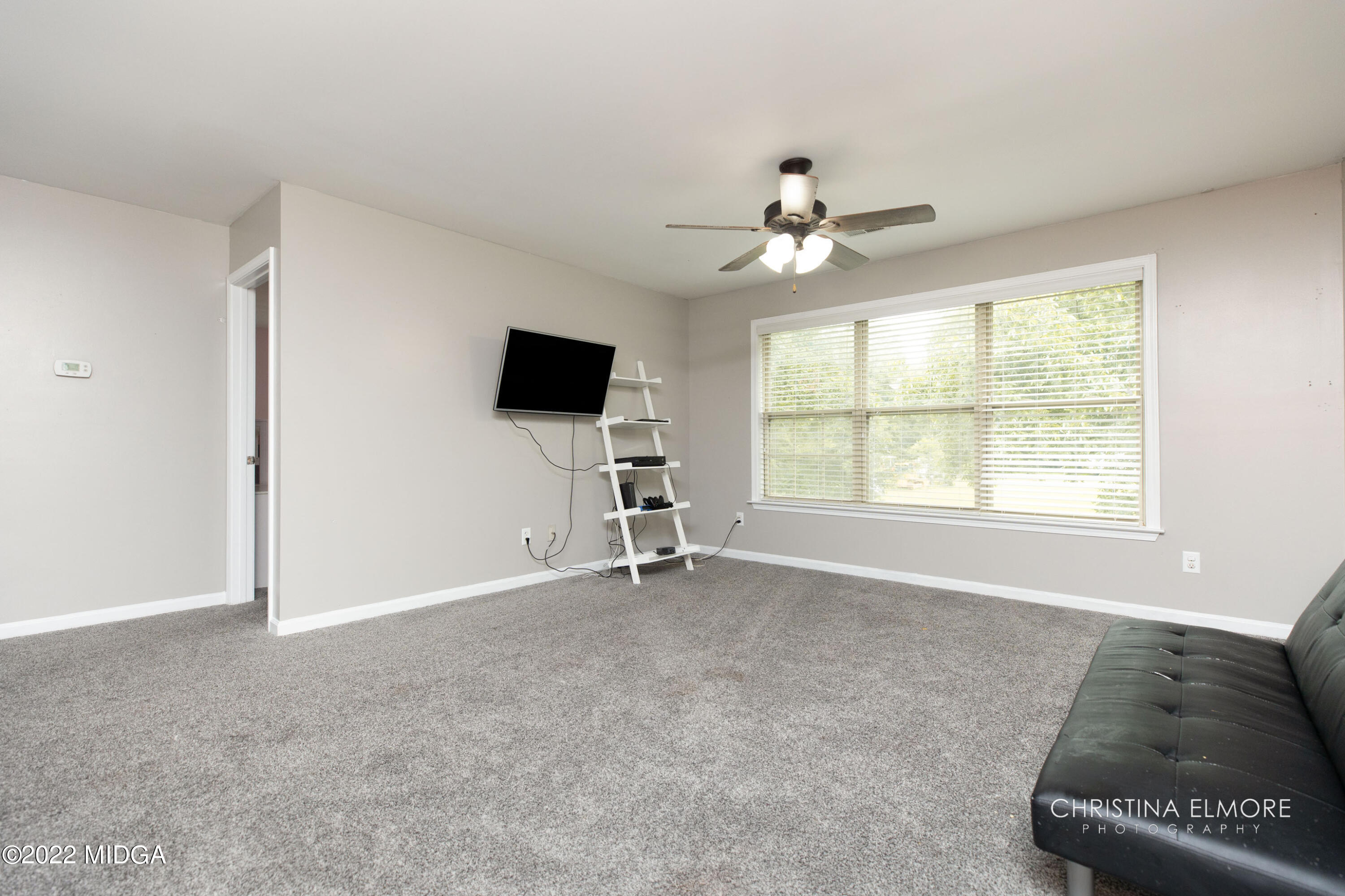 209 McEwen Court Perry, GA 31069 - Photo 22 of 39 a view of workspace with a window and a ceiling fan
