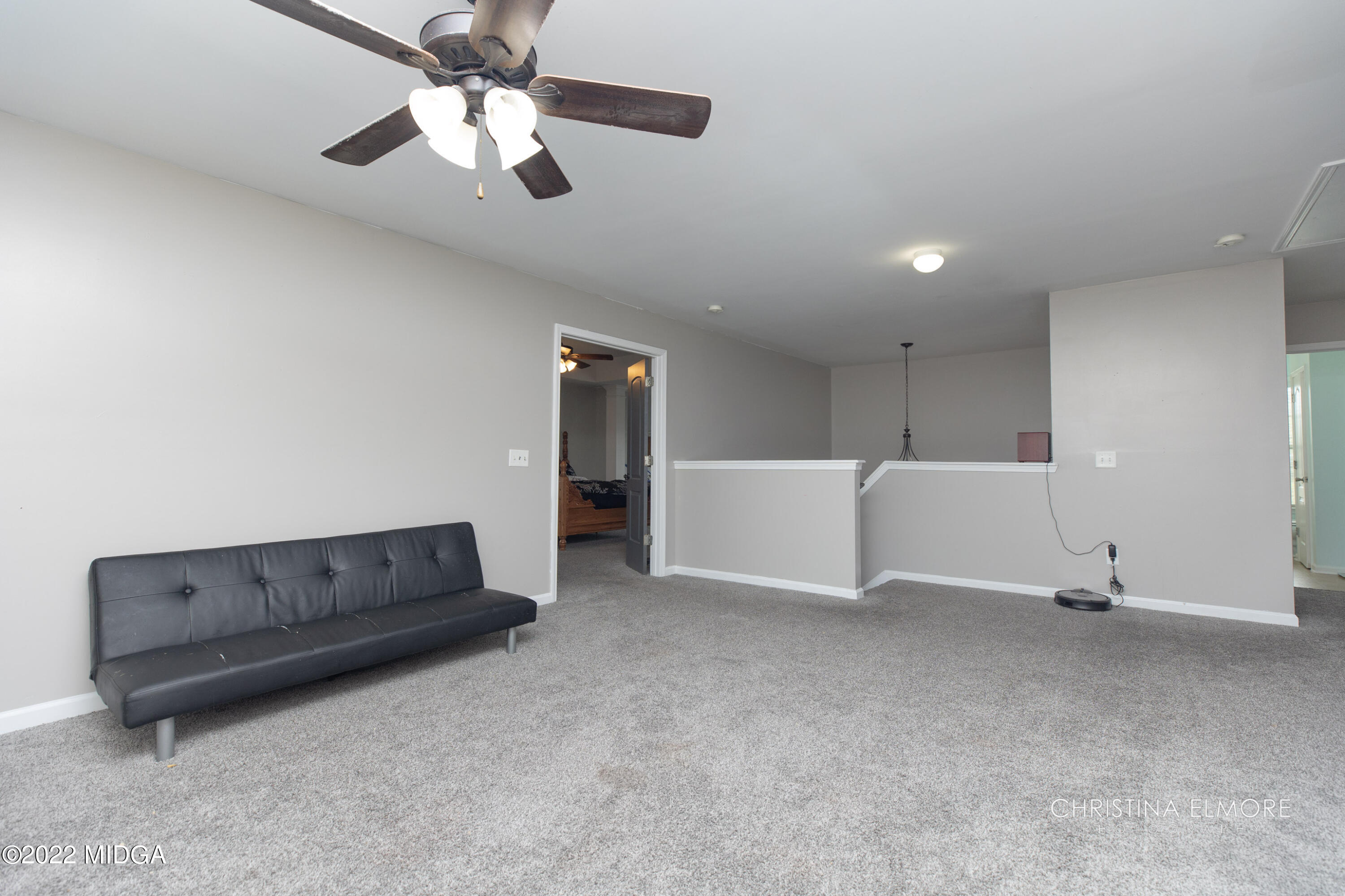 209 McEwen Court Perry, GA 31069 - Photo 23 of 39 a living room with furniture and a ceiling fan