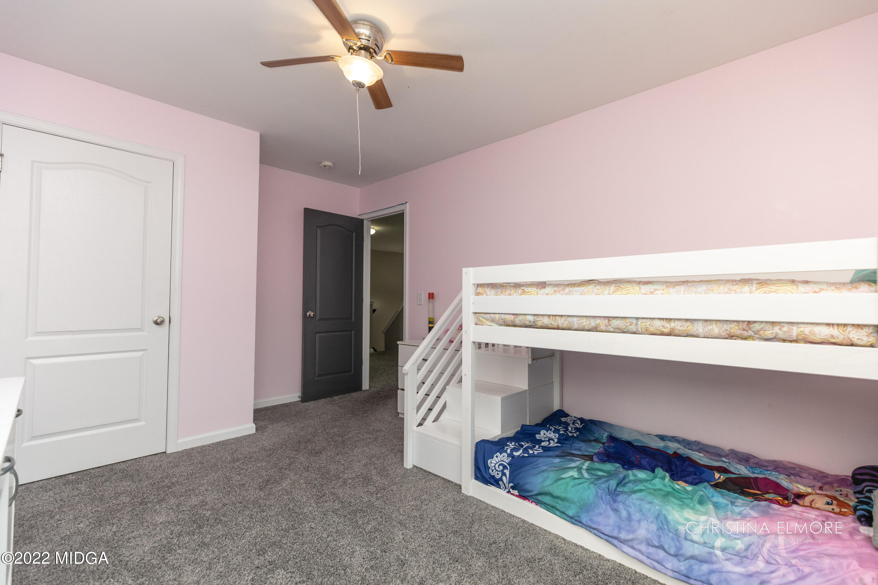 209 McEwen Court Perry, GA 31069 - Photo 30 of 39 a room with a walk in closet and wooden floor