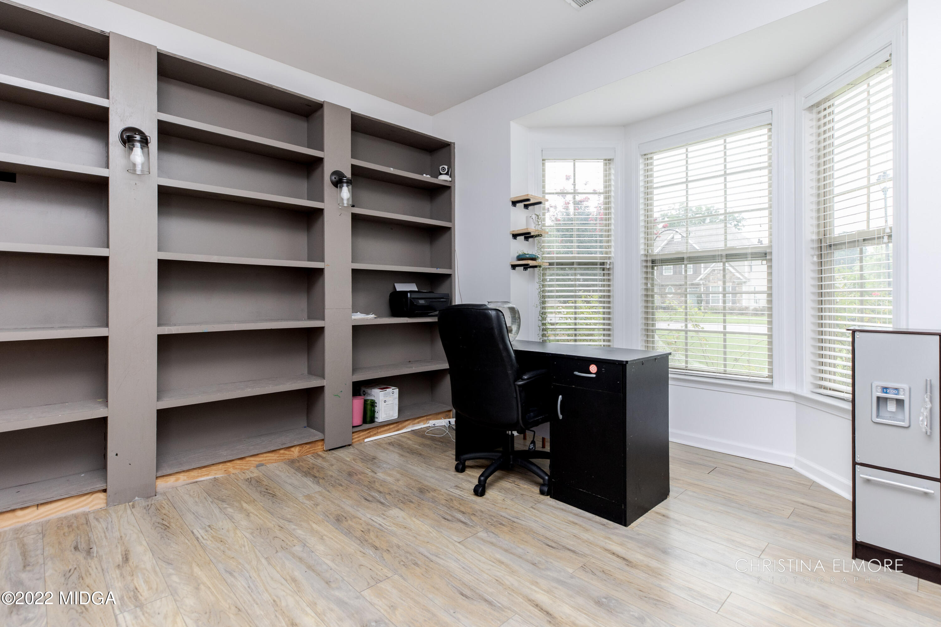 209 McEwen Court Perry, GA 31069 - Photo 6 of 39 a view of a workspace with furniture and a window