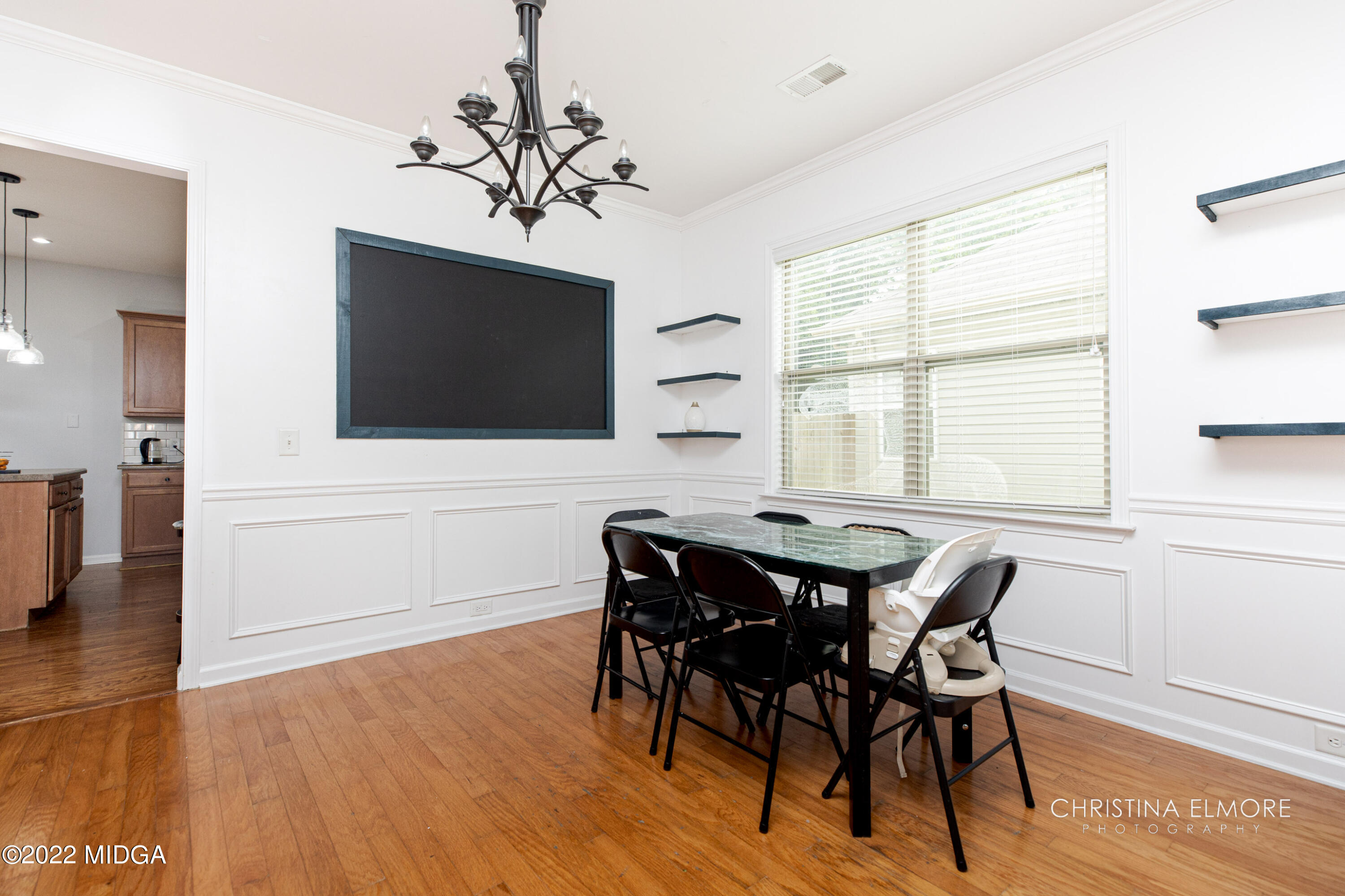 209 McEwen Court Perry, GA 31069 - Photo 8 of 39 a view of a dining room with furniture and wooden floor