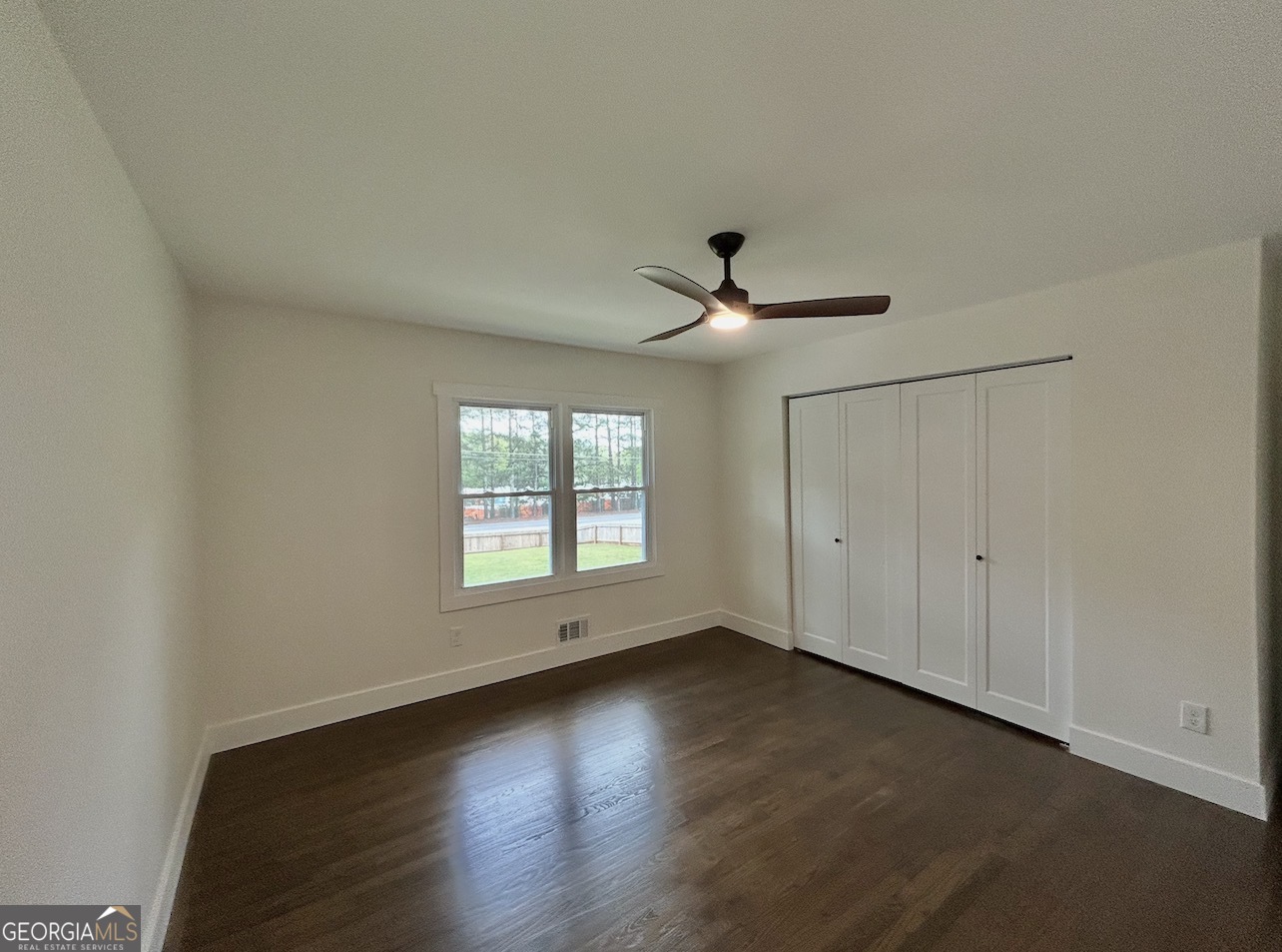 1742 Constitution Road Southeast Atlanta, GA 30316 - Photo 14 of 32 a view of empty room with wooden floor and fan