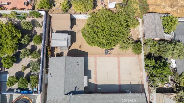 an aerial view of a house with a yard