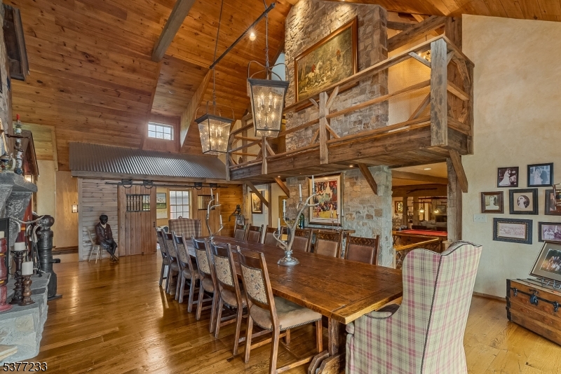 106 Mountain Top Road Glen Gardner, NJ 08826 - Photo 12 of 48 a dining room with lots of wooden furniture and chandelier