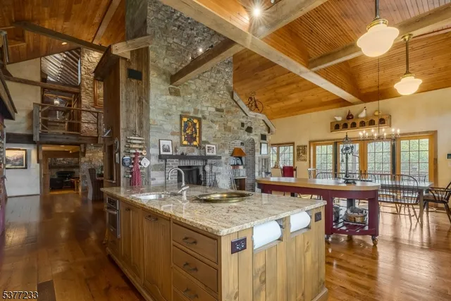a kitchen with stainless steel appliances granite countertop a stove and a wooden cabinets