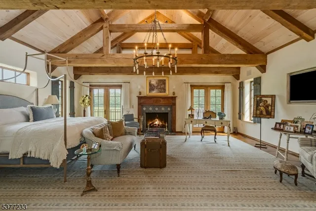 a large spacious bathroom with a tub a double vanity sink and a large mirror