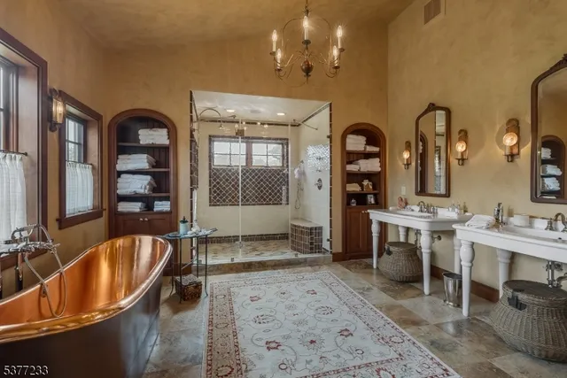 a view of living room with a bath tub and a mirror