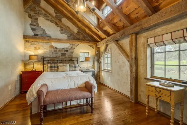 a bedroom with a bed and a couch