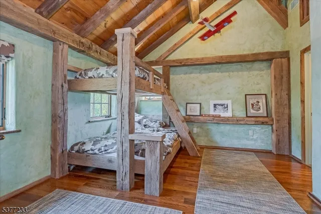 a view of a dining room with furniture wooden floor and a rug