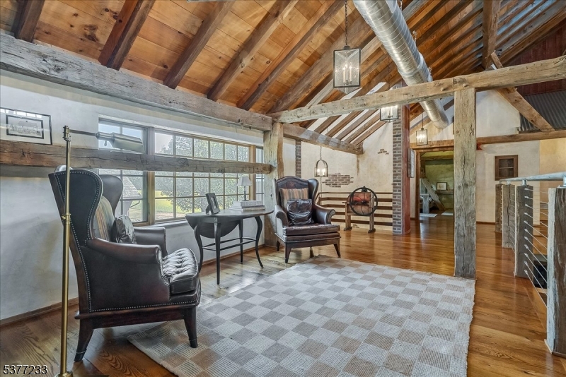 106 Mountain Top Road Glen Gardner, NJ 08826 - Photo 28 of 48 a view of a dining room with furniture wooden floor and a rug