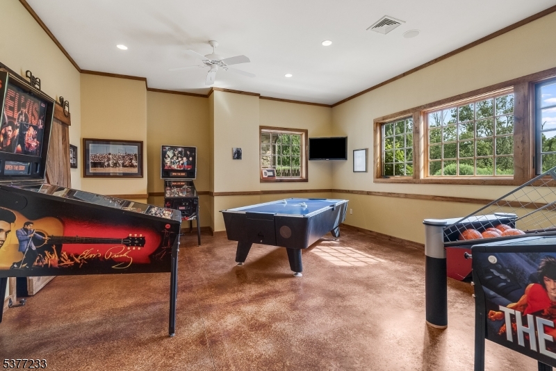 106 Mountain Top Road Glen Gardner, NJ 08826 - Photo 33 of 48 a living room with furniture and a flat screen tv