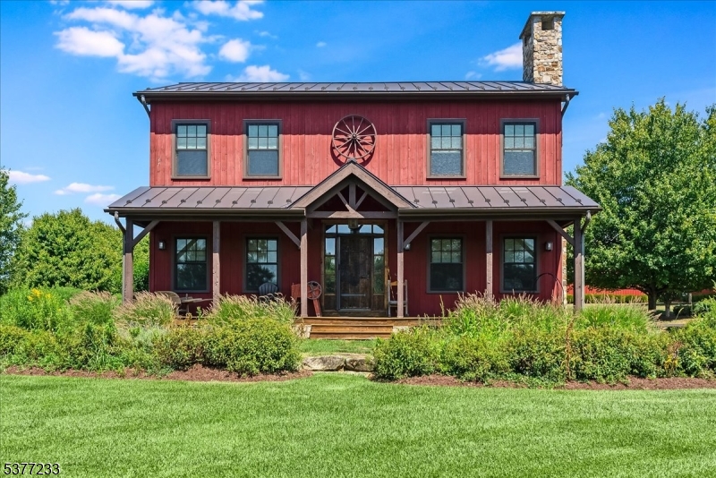 106 Mountain Top Road Glen Gardner, NJ 08826 - Photo 36 of 48 a front view of a house with garden