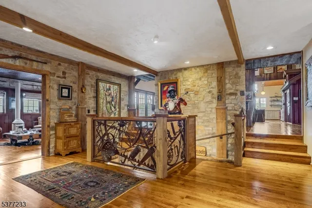a view of an entryway with a table and chairs
