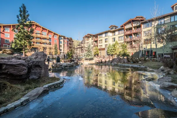 a view of a water fountain and a terrace