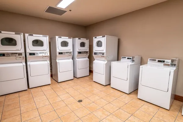 a view of a swimming pool with outdoor seating and plants