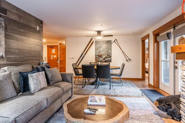 a living room with furniture and wooden floor