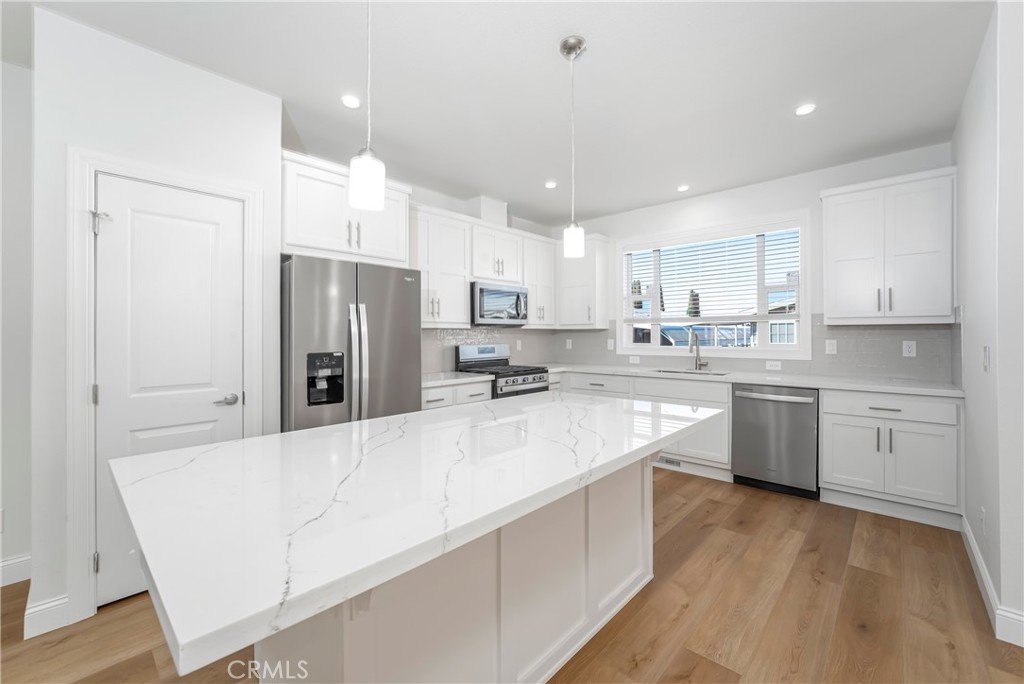 14851 Jeffrey Road, Unit 145 Irvine, CA 92618 - Photo 7 of 28 Island kitchen with pantry