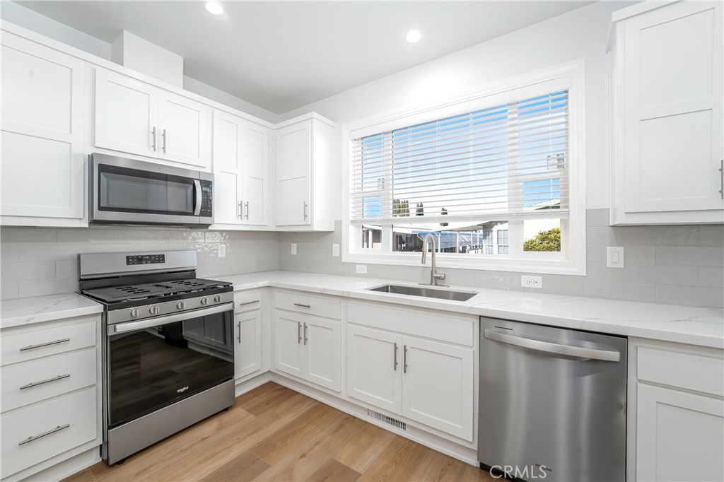 14851 Jeffrey Road, Unit 145 Irvine, CA 92618 - Photo 9 of 28 Island kitchen with pantry