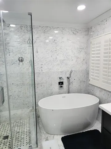 a white bath tub sitting in a bathroom