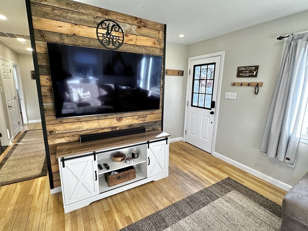 75 Coburn Road Berlin, MA 01503 - Photo 11 of 39 a living room with stainless steel appliances furniture and a flat screen tv