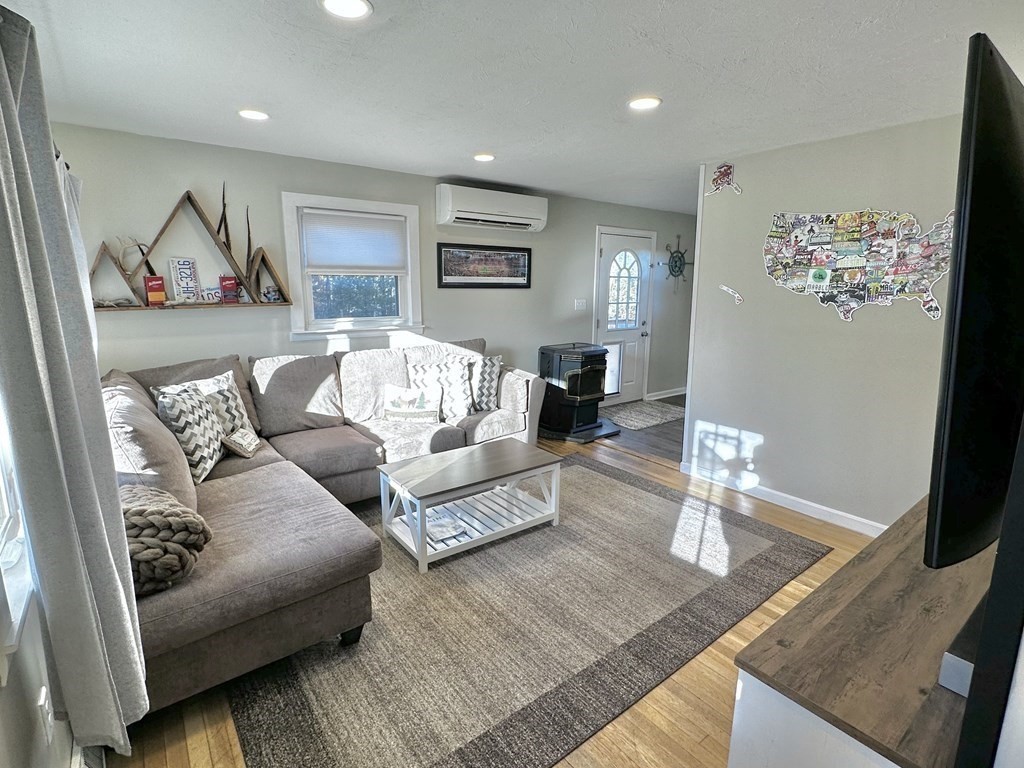 75 Coburn Road Berlin, MA 01503 - Photo 12 of 39 a living room with furniture and wooden floor