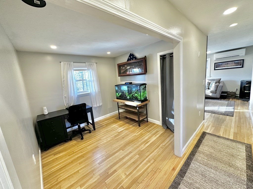 75 Coburn Road Berlin, MA 01503 - Photo 17 of 39 a bedroom with furniture and a wooden floor