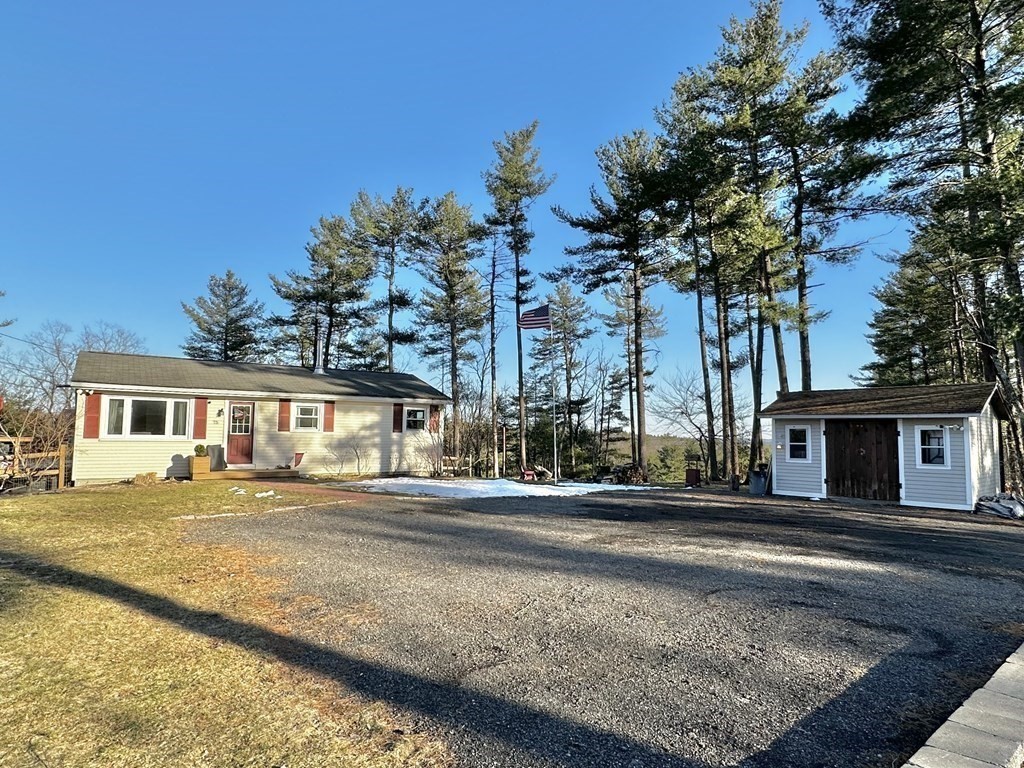 75 Coburn Road Berlin, MA 01503 - Photo 2 of 39 a front view of a house with a yard